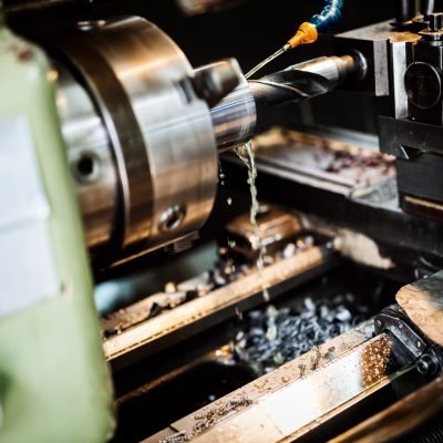 Automated drilling machines processing metalwork for assembly robots